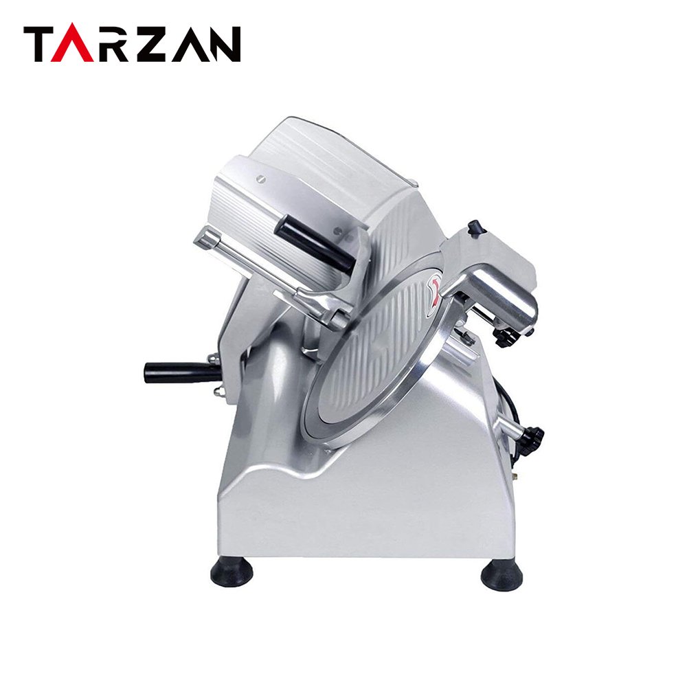 Side angle view of commercial meat slicer showing inclined feeding carriage