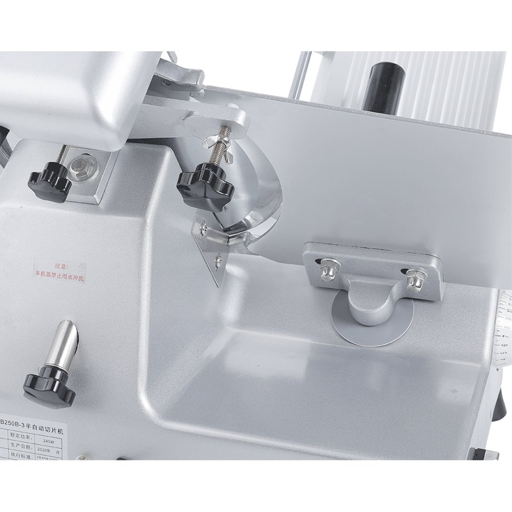 Detailed view of knife guard locking knob and thickness adjustment calibration