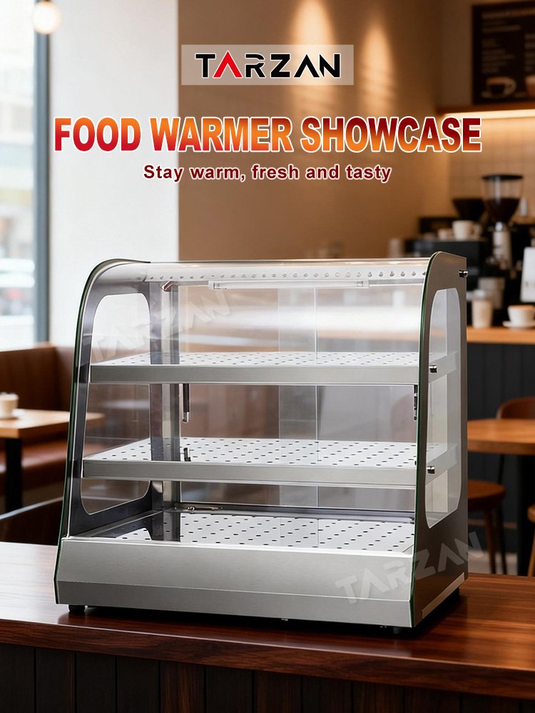 Commercial heated food display cabinet illuminated on cafe countertop holding warm food