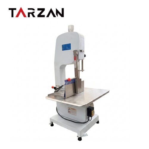 Commercial bone saw machine JG-310 with a vertical saw blade, stainless steel cutting table and adjustable product guide on a white background.