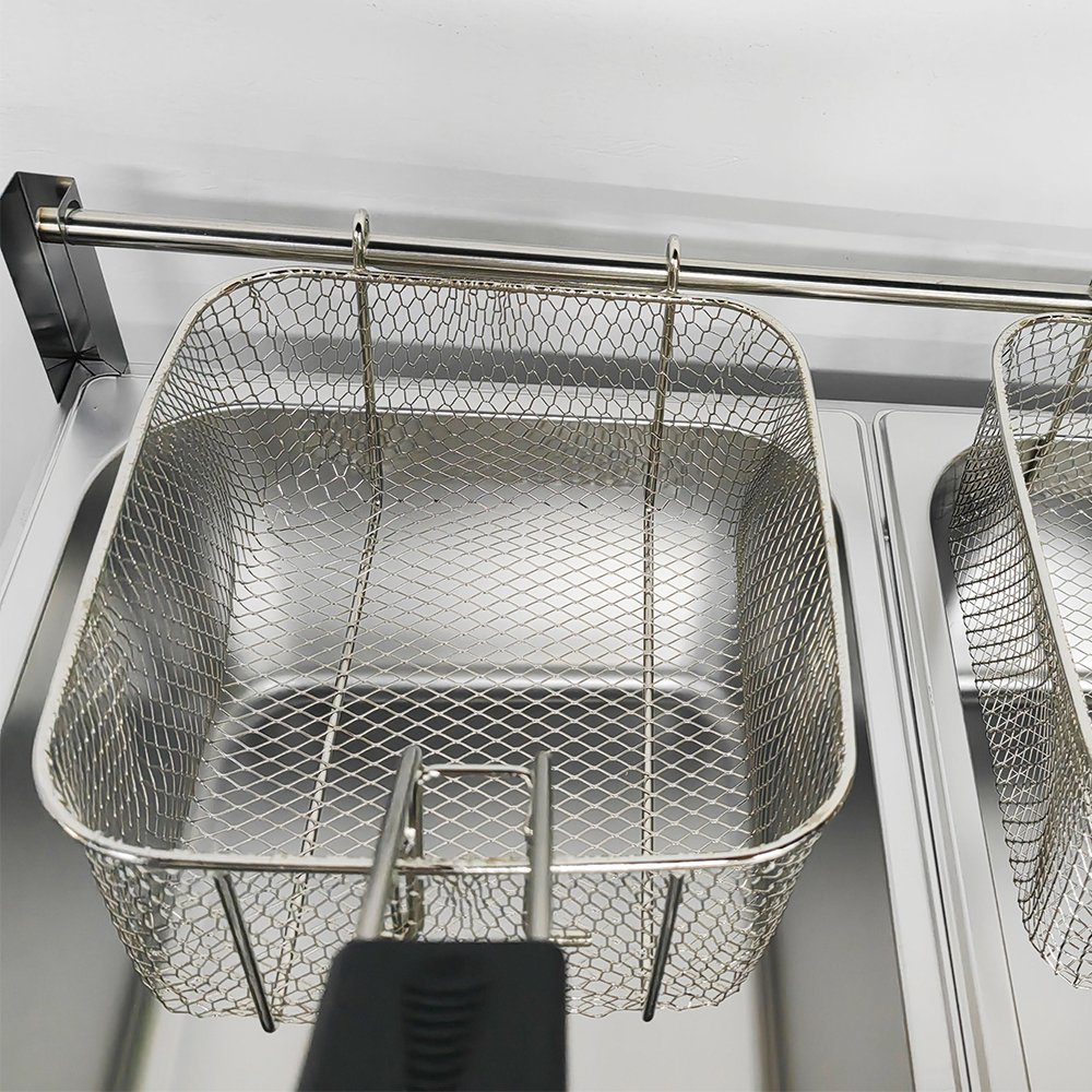 Close-up shot of reinforced wire fry basket hanging on rear crossbar rack