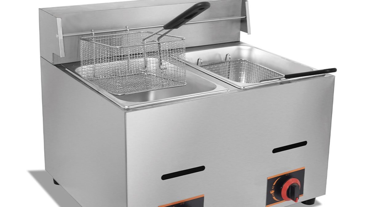 Close-up of the front control panel on a gas deep fryer showing the rotary thermostat dial, power indicator light and timer.
